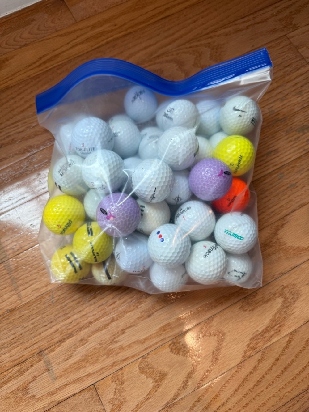 59 Assorted White and Colored Golf Balls - Mixed Brands